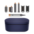 Dyson Airwrap Multi Styler with multiple attachments displayed alongside a blue storage case, showcasing the copper and nickel finishes.